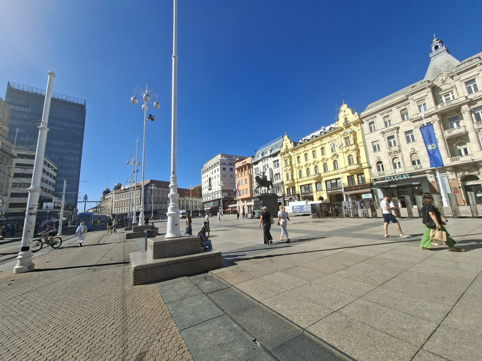 Open square in central Zagreb with pedestrians, wide pavements, and historic buildings.